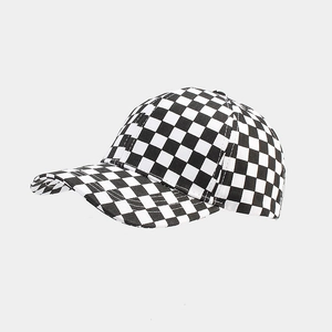Detail of classic black and white checkerboard baseball cap with cotton canvas texture