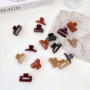 Assorted jelly texture mini hair claw clips in brown, amber and black for women