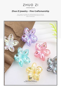 Macro view of plumeria hair claws featuring laser iridescent finish in multiple colors