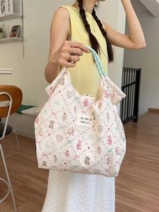 Quilted cartoon print tote bag with cute animal patterns and light blue handles