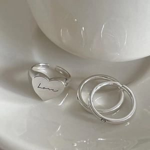 Three-piece 925 sterling silver ring set featuring a Love engraved heart signet ring