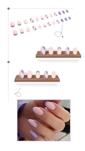 Close-up of pink and purple wavy press-on nails with medium round shape on white background