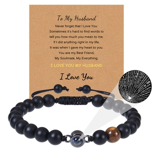 Detail of beaded husband bracelet with tiger eye stone and greeting card message