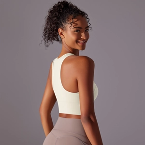 Detail of cream white racerback sports bra with wide hem for yoga and fitness