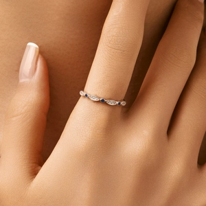 Sparkling S925 sterling silver wave ring featuring blue and white cubic zirconia accents
