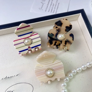 Detailed set of three French acetate hair clips with pearls and vintage textures