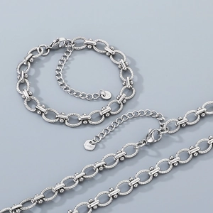 Polished stainless steel oval link chain necklace and bracelet set with S.STEEL tags