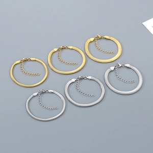 Flat snake bone chain bracelets in gold and silver steel with adjustable lobster clasps