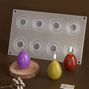 Macro detail of 8-cavity egg silicone mold with finished DIY colorful candle crafts