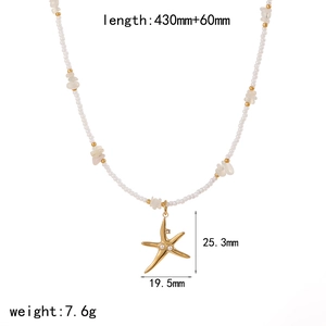 Detailed size view of gold starfish pendant with pearls and ocean style shell chain