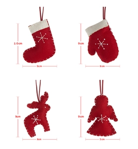 Detail view of red and white felt Christmas ornaments with precise size measurements