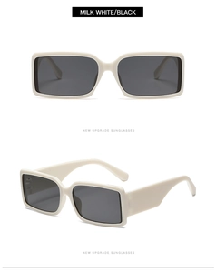 Detail view of milk white rectangular sunglasses with black lenses and wide temples
