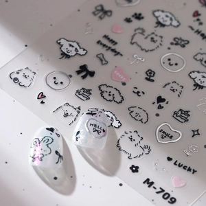 Cute puppy nail stickers with heart and bow designs on transparent film for DIY manicure