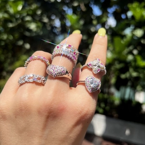 S925 sterling silver rings with pink heart and clover crystals on model hand