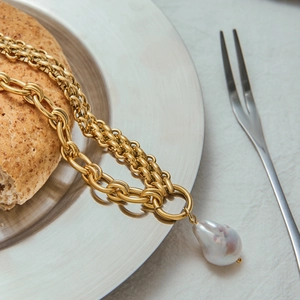 Elegant gold layered stainless steel chain necklace with a baroque pearl pendant