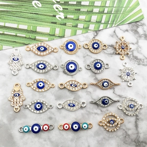 Close-up of Evil Eye jewelry connectors with rhinestones for DIY bracelet making