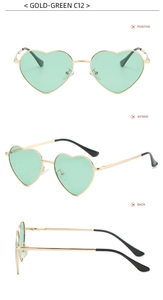 Detail view of gold-rimmed heart sunglasses with green lenses and spring hinges