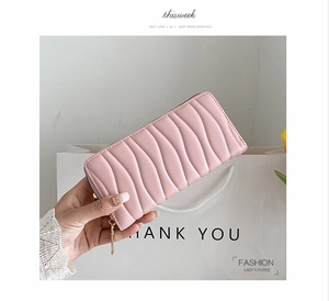 Pink PU leather long wallet with wave-quilted pattern and gold zipper detail