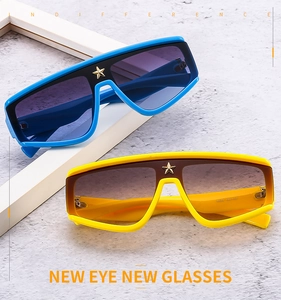 Detail of oversized sunglasses bridge with gold star metal decor and stylish dual colors