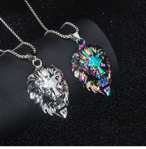 Detail of silver and rainbow lion head pendants on stainless steel necklaces for men