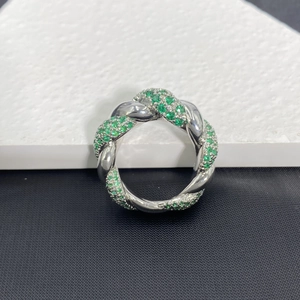 Twisted cable ring with green zircon stones in polished silver finish for women