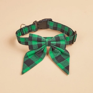 Detail of green buffalo plaid dog collar with removable bowtie and silver metal D-ring