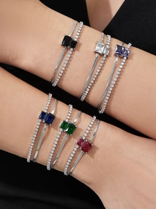 Detail of double-layer stainless steel bracelet with colored rectangular zircon stones