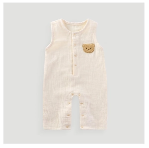 Detail of baby cotton gauze bodysuit featuring a cute brown plush bear patch applique