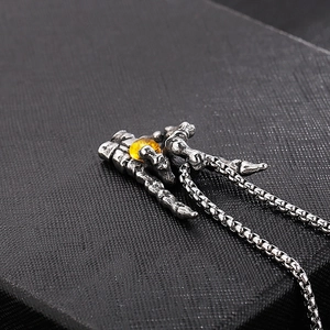 Retro stainless steel skull hand pendant with yellow tiger eye stone on metal chain