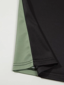 Close-up of contrast color hem stitching on breathable mesh knit polo shirt