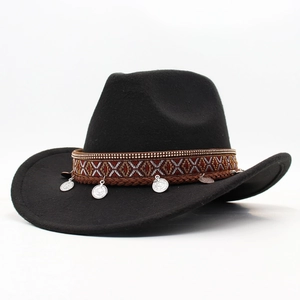 Detail of black wool felt cowboy hat with ethnic woven band and silver coin pendants
