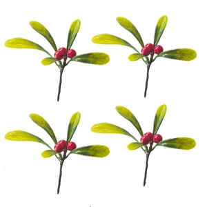 Detail of four artificial red berry stems with green leaves for Christmas decorations