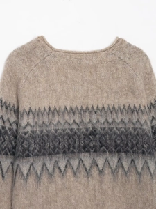 Close-up of jacquard knit sweater featuring brushed mohair texture and khaki geometric pattern