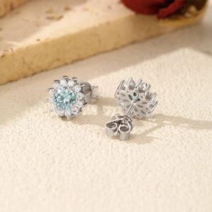 Exquisite S925 silver snowflake stud earrings with light blue moissanite and clear stones