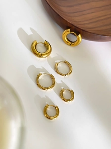 Three-piece gold plated stainless steel hoop earrings set in varied sizes and thickness