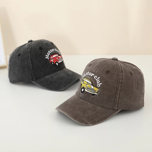 Close-up of vintage car embroidery and Motor Club text on washed cotton baseball caps