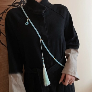 Close-up of light cyan glass beads necklace with long tassel on Hanfu accessory