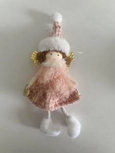 Detail of pink Christmas angel plush ornament with knitted skirt and golden wings