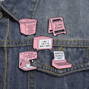 Pink creative cartoon enamel pins set featuring typewriter and signs on denim jacket