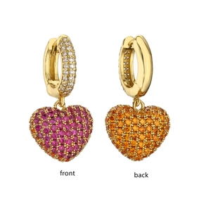 Two-tone heart pendant earrings with pink and orange crystals shown front and back