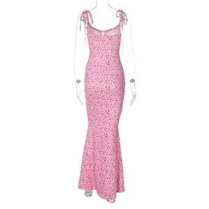 Detail of pink floral maxi dress featuring adjustable spaghetti straps and fishtail hem