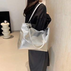 Silver woven metallic oversized tote bag for women, modern minimalist shoulder bag style