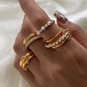 Stackable gold stainless steel ring set with white pearls and sparkling zircons