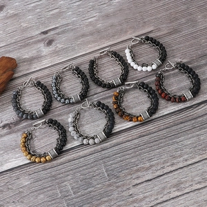 Close-up of double-layer vintage men's bracelets with natural stones and metal chains