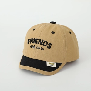 Close-up of FRIENDS embroidery and soft brim on khaki-black bicolor children cap