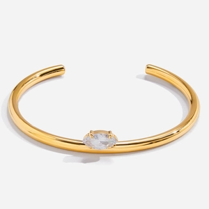 Close-up of 18K gold-plated stainless steel cuff with marquise white zircon inlay