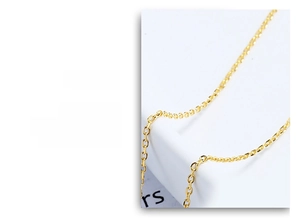 Macro shot of polished gold O-chain necklace with adjustable needle pin DIY jewelry link