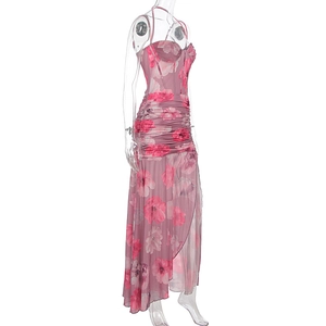 Detail of ruched floral mesh dress with corset bodice and high slit side profile