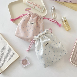 Floral drawstring storage pouches for travel and makeup with blue flower patterns