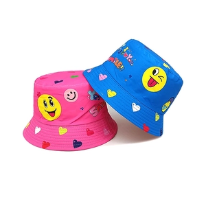 Kids' digital print reversible bucket hats with yellow smiley faces and heart patterns